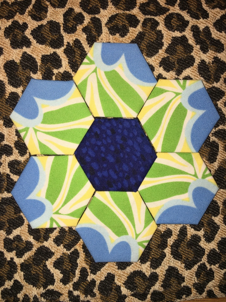A quilt block made from hexagons on a place mat.